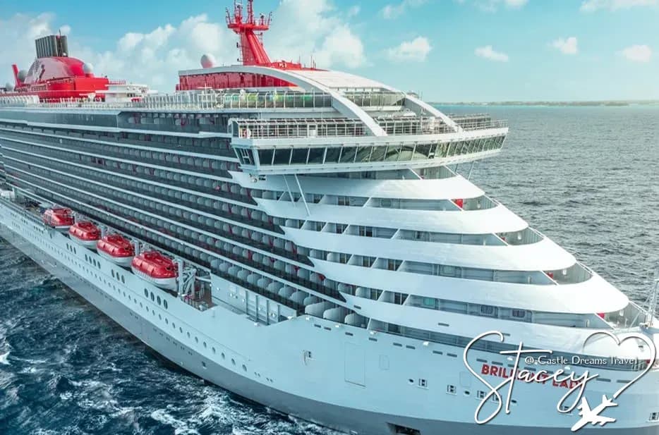 Virgin Voyages' Brilliant Lady at sea, name visible on the bow