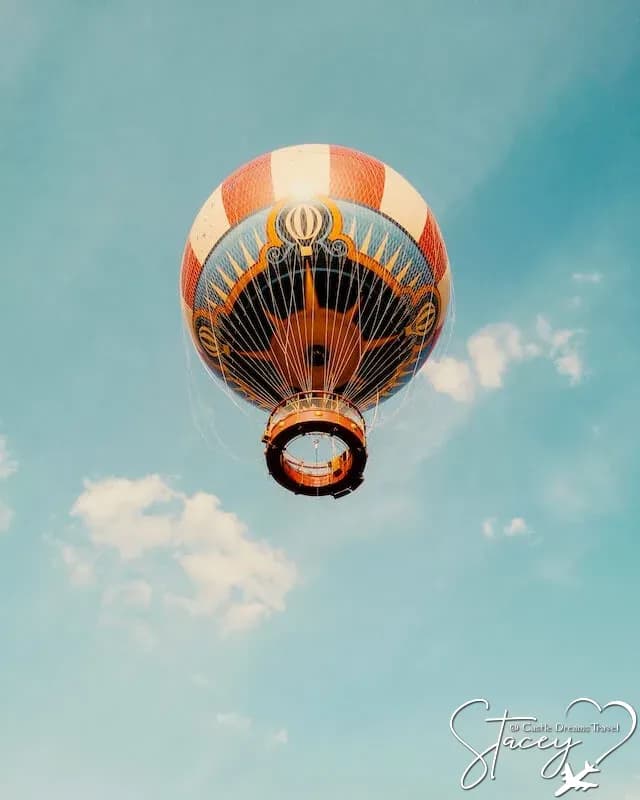 Striped hot air balloon floating in a blue sky