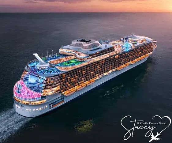Royal Caribbean cruise ship at sea at dusk with its decks lit up
