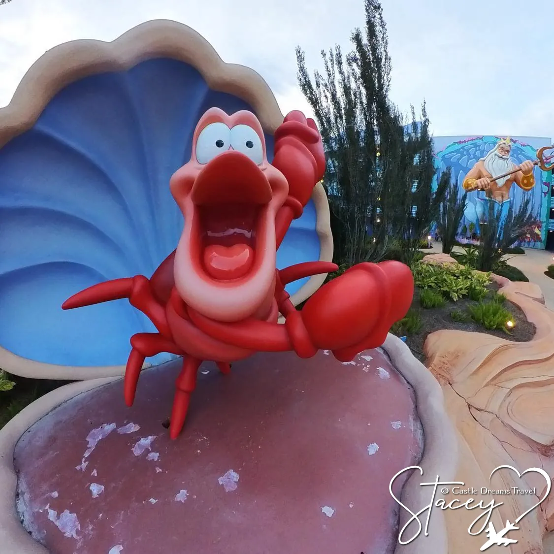 Larger-than-life Sebastian the crab statue in the Little Mermaid courtyard at Disney's Art of Animation Resort