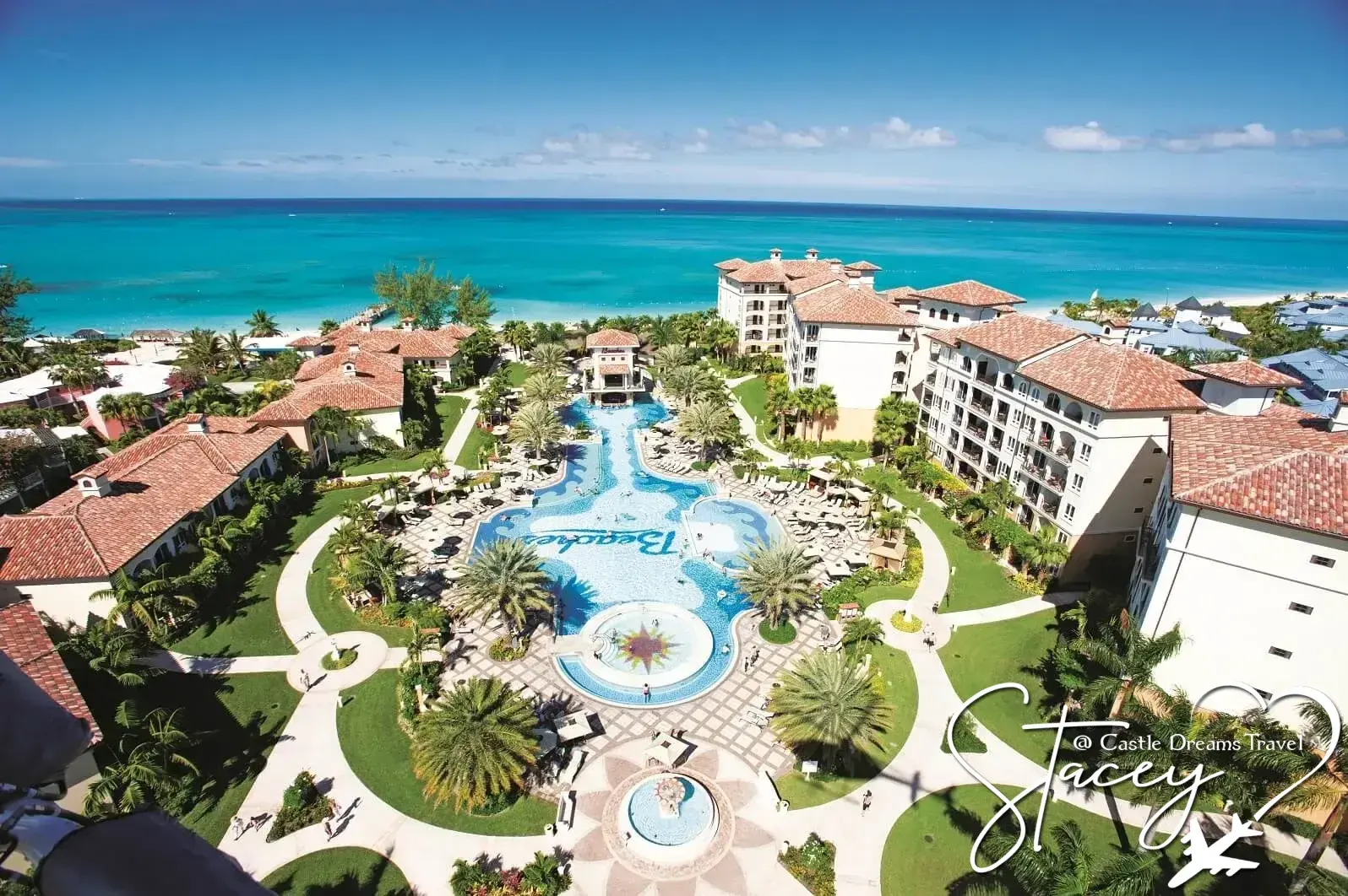 Aerial view of a family-friendly Beaches all-inclusive resort with pools beside a turquoise ocean