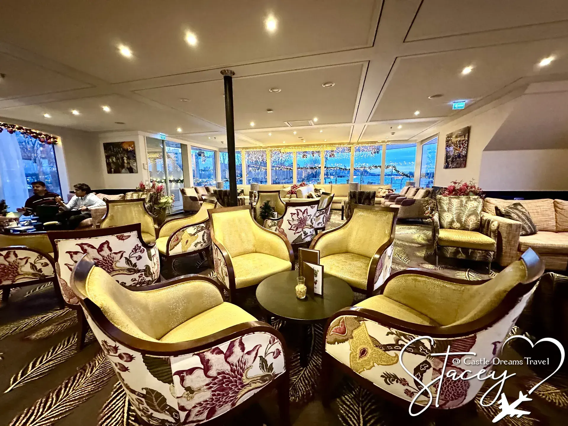 Panoramic river-view lounge aboard an AmaWaterways ship
