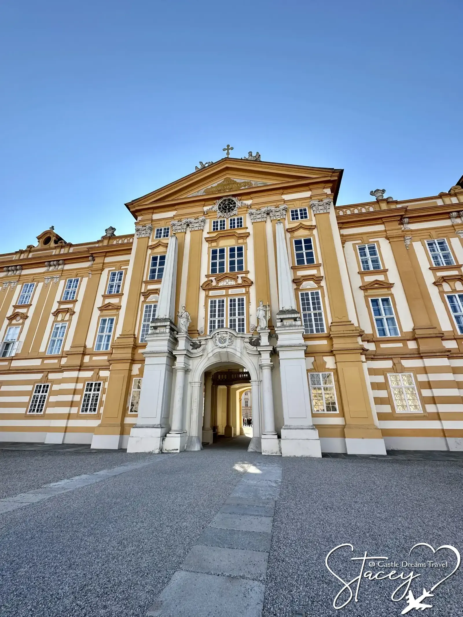 Forecourt facade of Melk Abbey in golden yellow