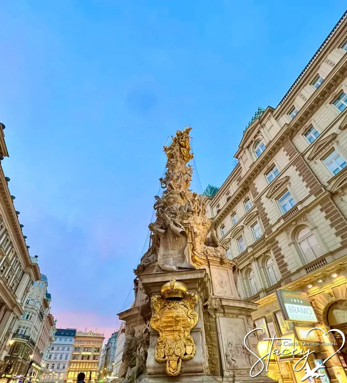 Golden plague column on the Graben shopping street at dusk, Vienna