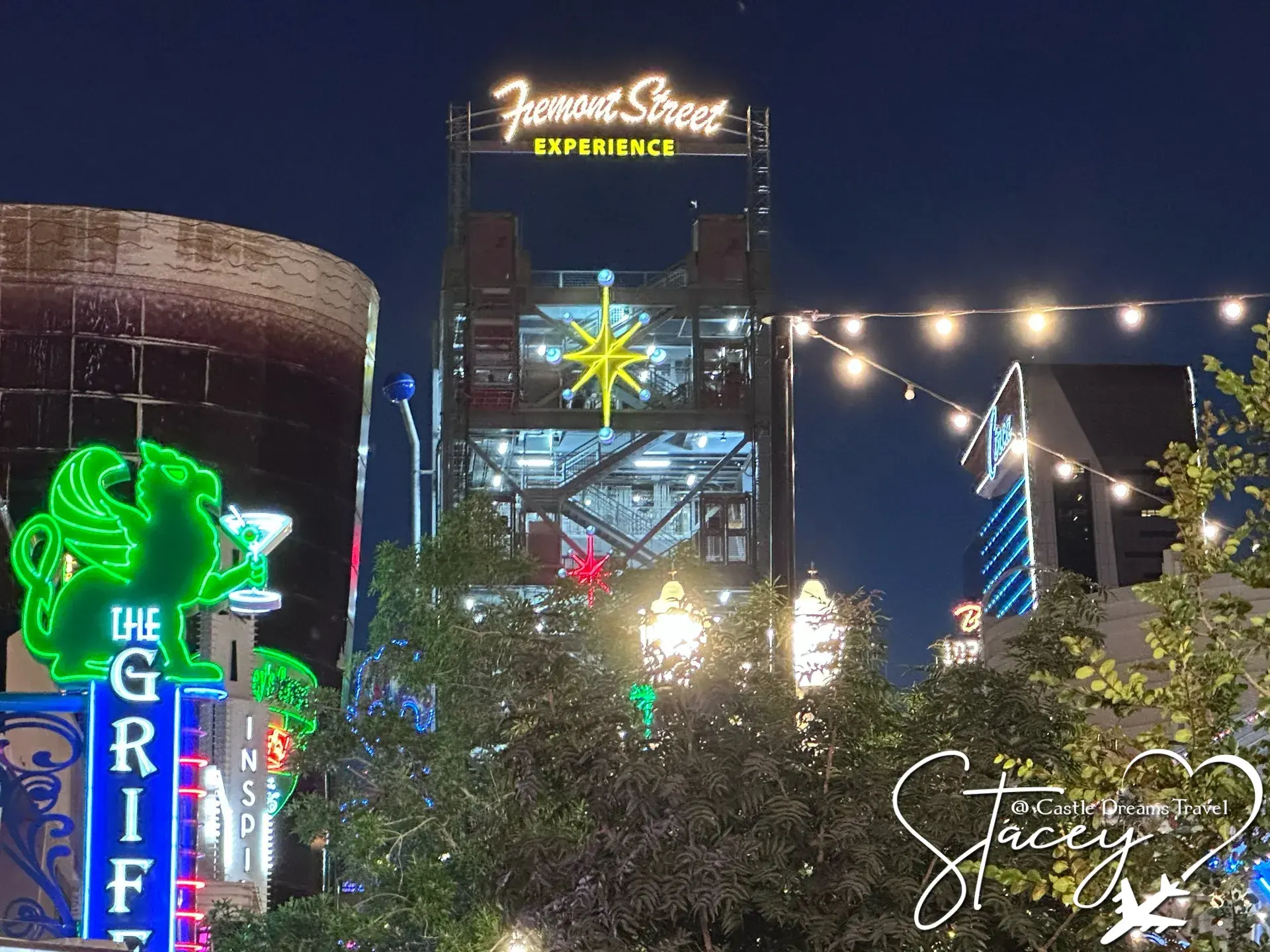 The Fremont Street Experience sign lit against the evening sky in downtown Las Vegas