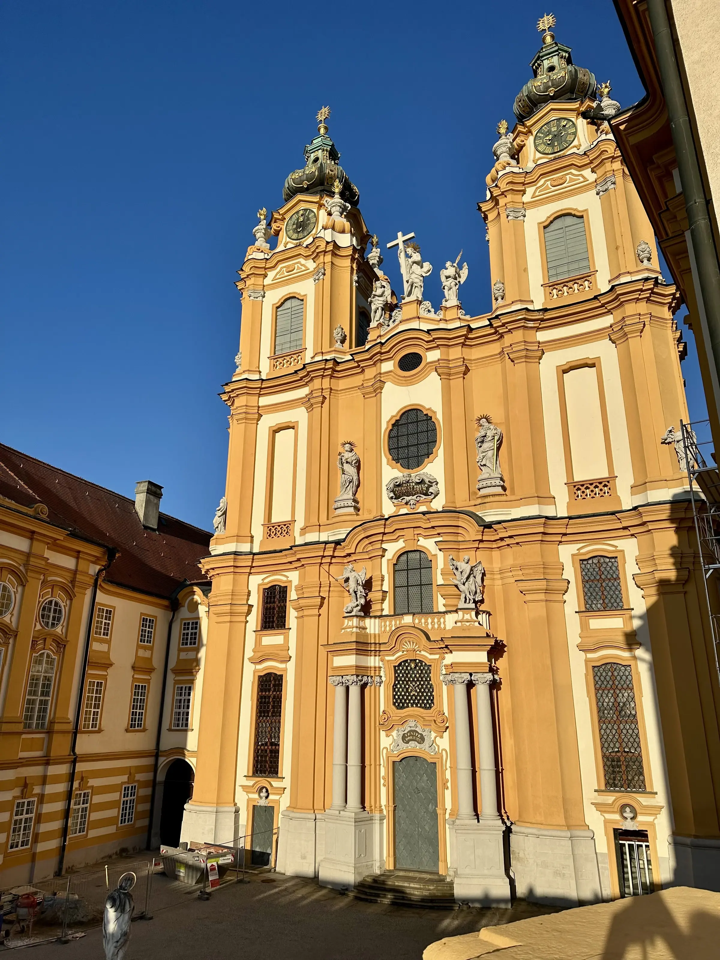 The twin Baroque bell towers of Melk Abbey's church against a clear blue sky, Wachau Valley, Austria