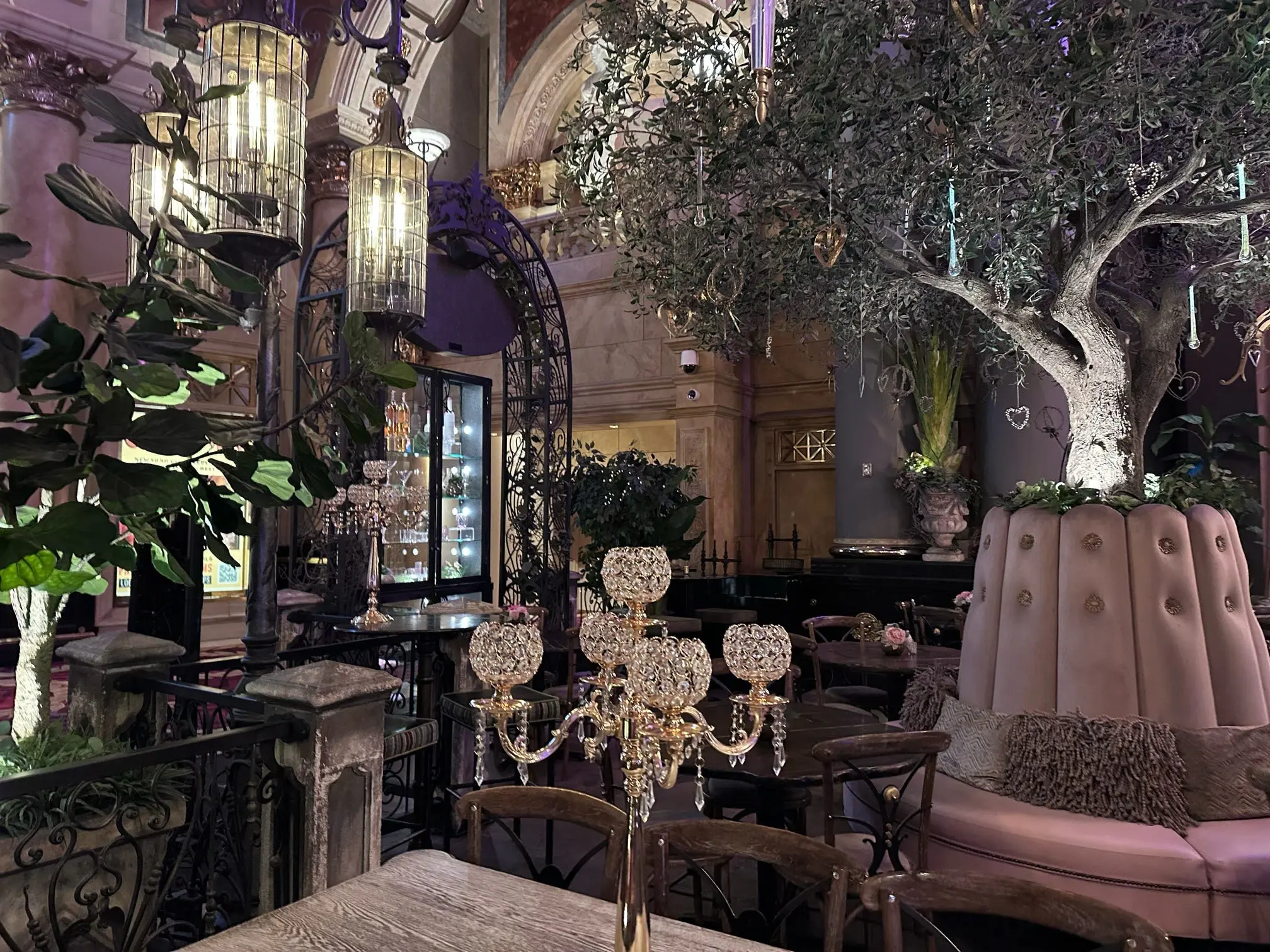 Chandeliers and olive trees inside a Las Vegas cocktail garden
