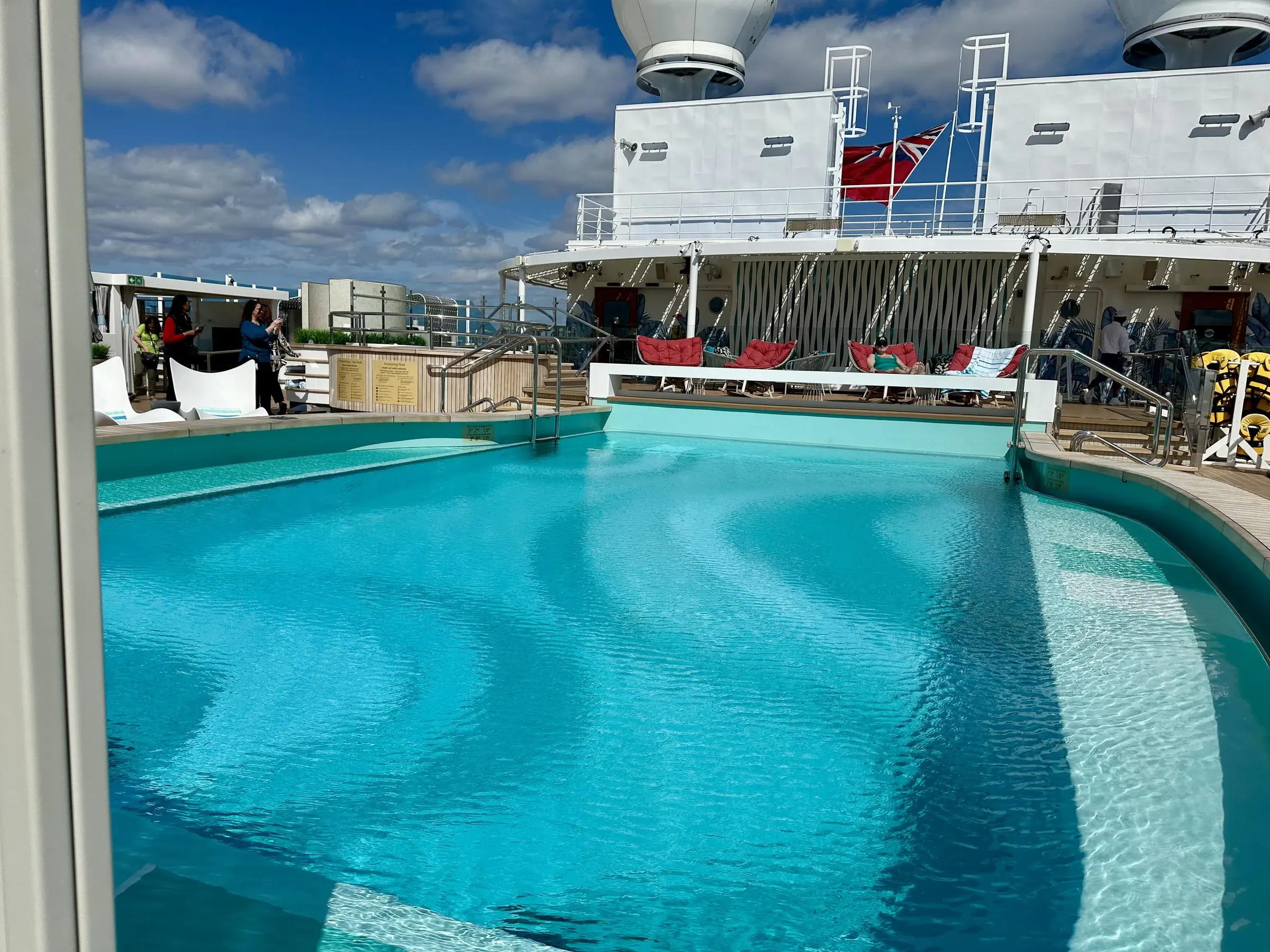 The main pool deck of a Princess ship under a bright sky