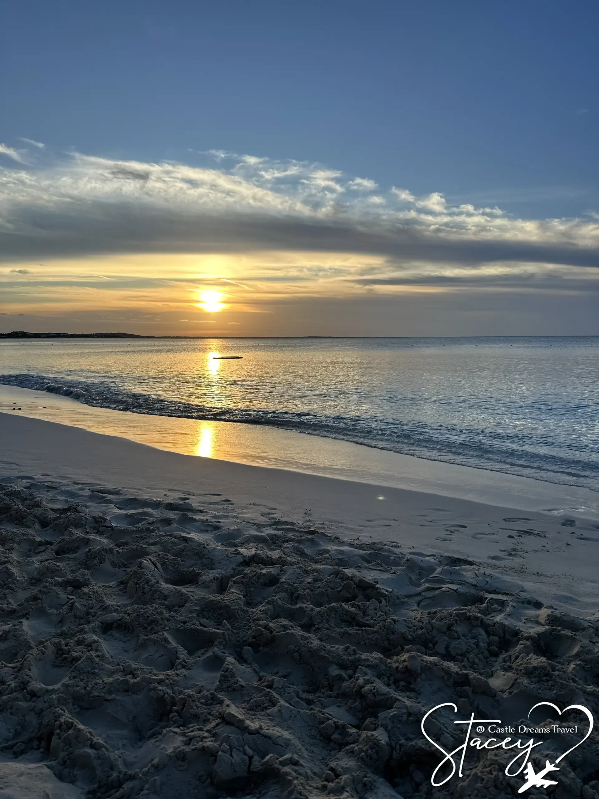 Sun setting over the ocean from a quiet beach