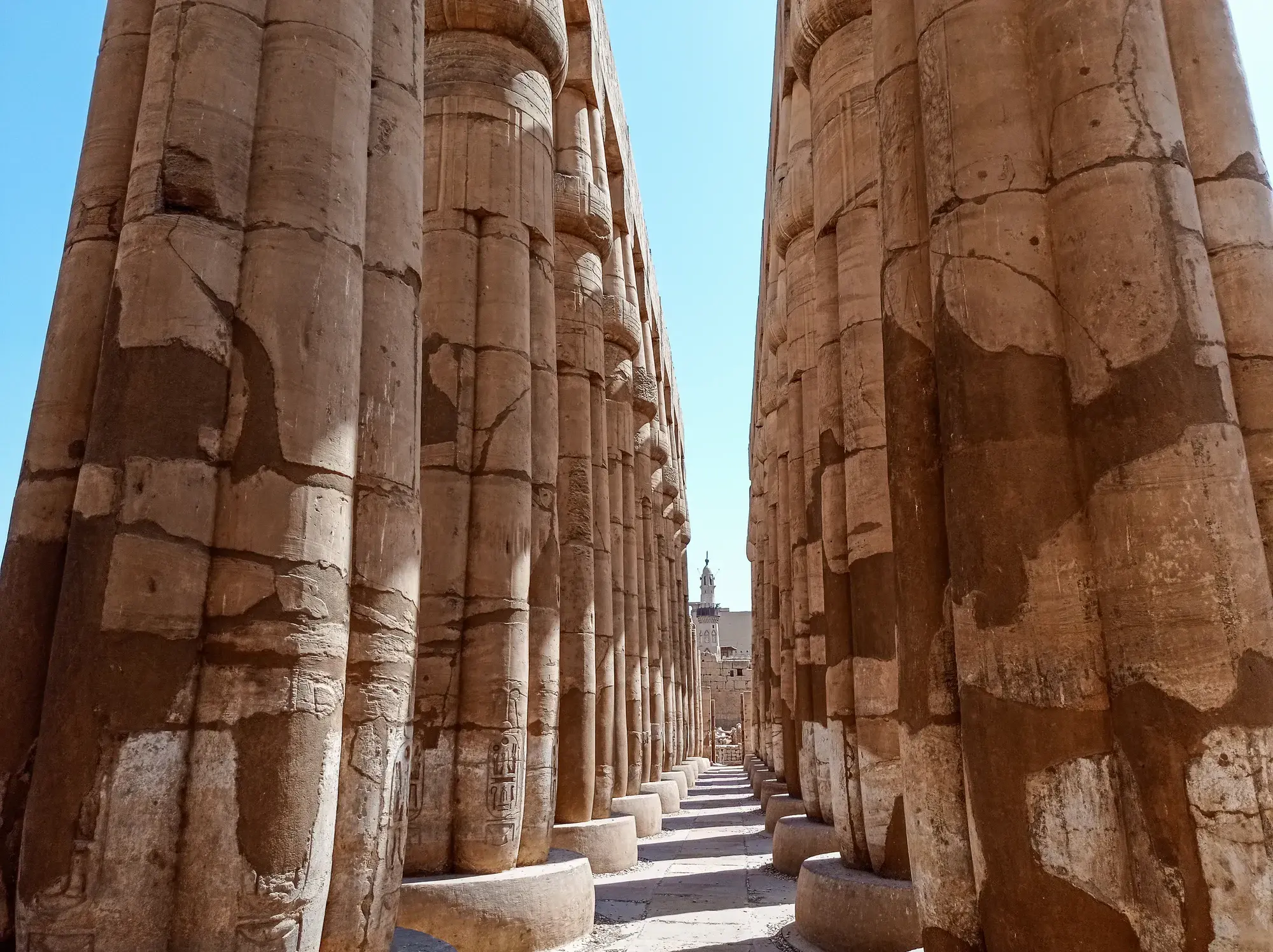 Ancient hieroglyph-covered columns at Luxor Temple in Egypt